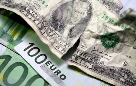 Dollar bounces off lows; euro hit by weak PMI data