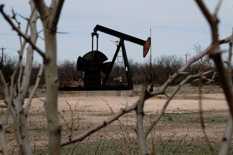 Oil flat, poised to end week higher on Fed rate cuts, lower US supply