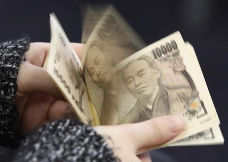 Japanese yen slides past key 155 level after BOJ holds rates steady