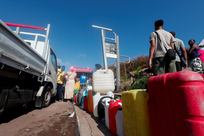 Angry residents of cyclone-hit Mayotte jeer Macron, plead for water