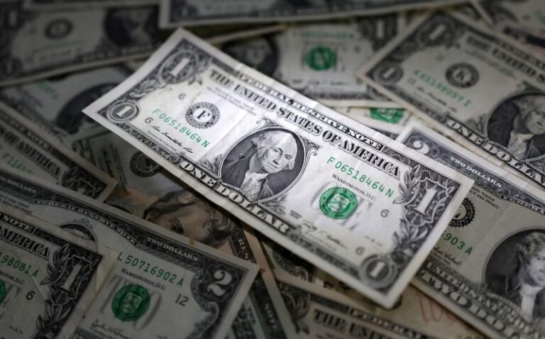 Dollar flat in choppy trading as investors await tariff certainty